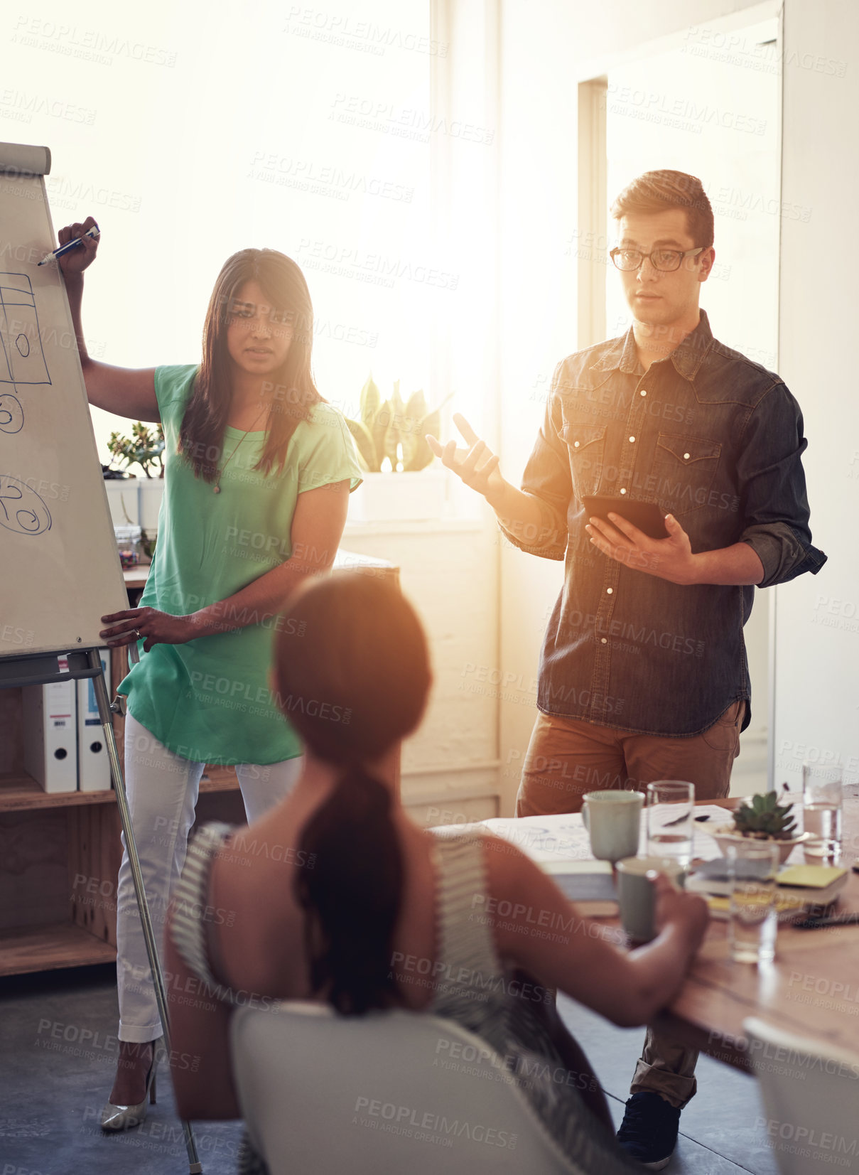 Buy stock photo Presentation, man and woman in office for meeting, teamwork and business or leadership. Collaboration, brainstorming and people with diversity in conference room for coaching or strategy for company