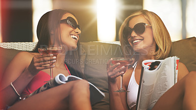 Buy stock photo Friends, women and happy with alcohol at hotel, bonding and drinking wine on tropical vacation. People, reading news and magazine for gossip on summer holiday, weekend trip and travel to resort