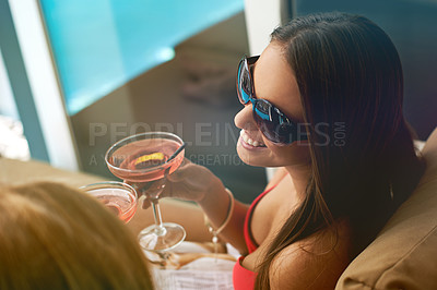 Buy stock photo Women, friends and cocktail at swimming pool for summer party with alcohol for relax, sunshine or vacation. Female people, drinks and cheers on patio in Miami for bikini holiday, bonding or weekend