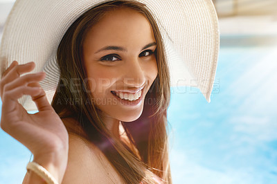 Buy stock photo Smile, portrait and woman at swimming pool with hat, sunshine and and travel for summer holiday at hotel. Relax, water and face of happy girl on luxury vacation with adventure, weekend and fun in sun