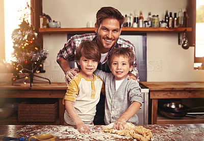 Buy stock photo Father, portrait and happy children baking at Christmas, learning or bonding together in home. Face, kids and dad cooking at xmas on holiday with flour for teaching brothers with family in kitchen