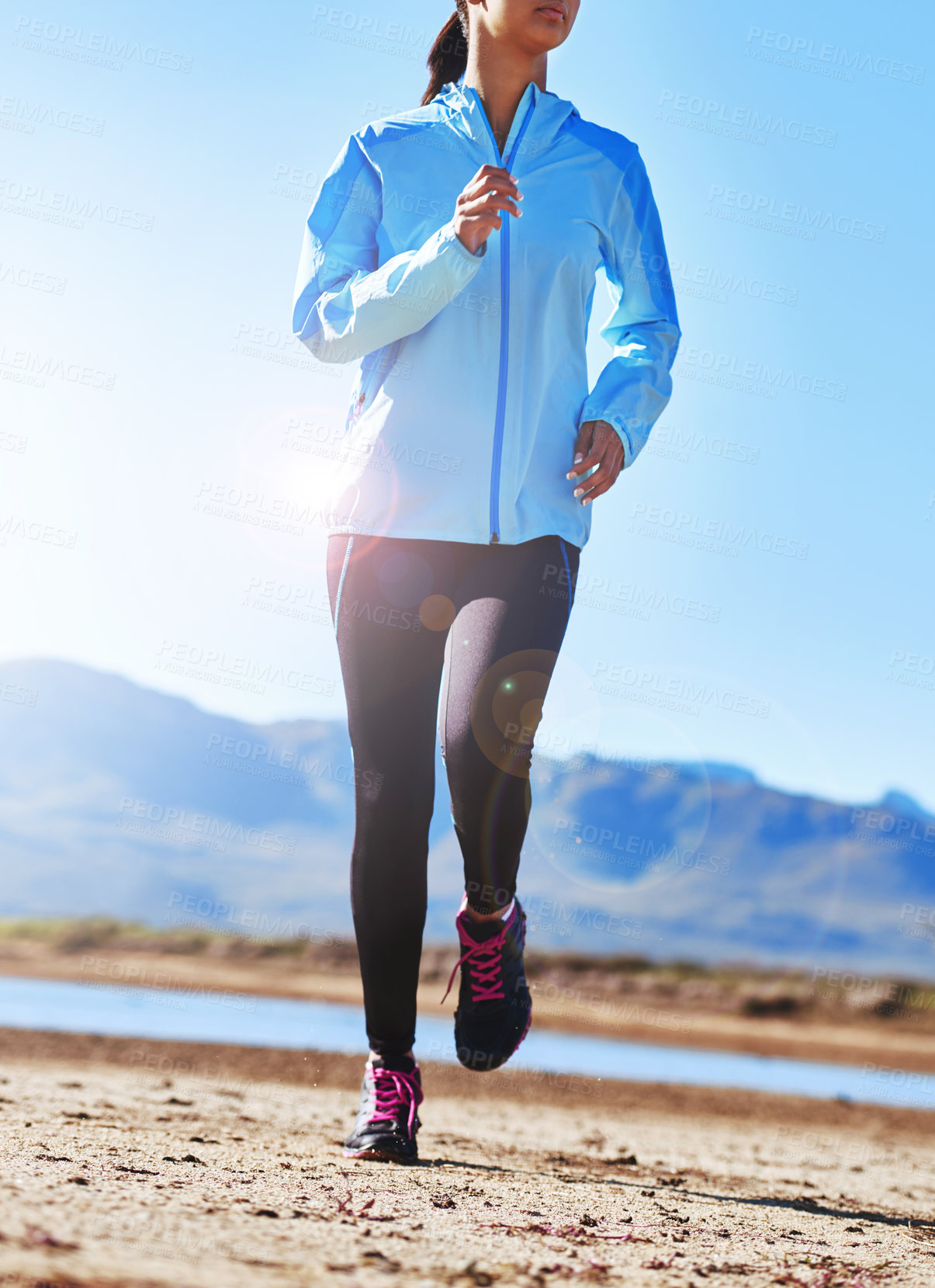 Buy stock photo Mountain, running and exercise for girl, fitness and workout in morning, summer and energy in bridge. Park, runner and female person in sportswear, cardio and training in nature, outdoor and speed