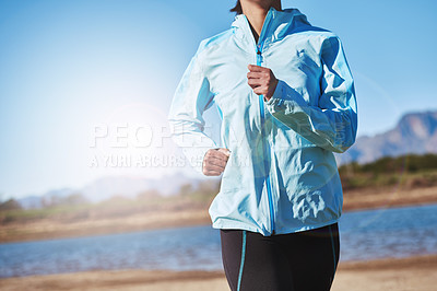 Buy stock photo Cropped shot of a woman running outdoors