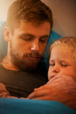 Buy stock photo A little girl asleep in her father's arms in bed
