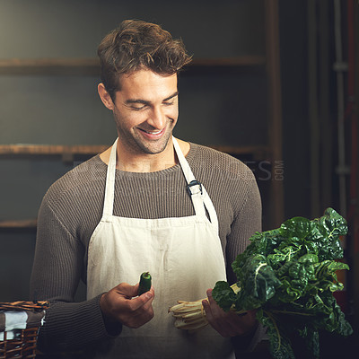 Buy stock photo Food, happy man with vegetables and chef in kitchen in his home. Healthy or nutrition diet with spinach, ingredients or recipe and smiling male person with apron prepare green salad at his house