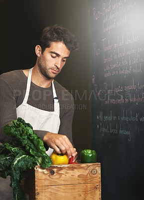 Buy stock photo Chef, basket and business owner with vegetables or groceries in a bag for cooking or diet in kitchen. Man packing, shopkeeper and person sorting healthy food dinner or packaging box of ingredients