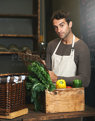 Buy stock photo Chef, checklist and portrait of man in restaurant with vegetables for vegetarian or vegan ingredients. Serious, male cook with clipboard and food from Norway for cooking in kitchen or small business.