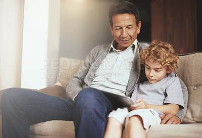 Buy stock photo Tablet, child or grandfather streaming movie or film on online subscription in retirement at home to relax. Bond, grandparent or kid loves watching fun videos with a senior or mature old man on sofa