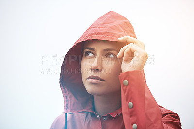 Buy stock photo Woman, rain jacket and thinking with hood for weather, cloudy sky or winter season in outdoor storm. Face of female person with red waterproof coat in wonder for rainy overcast or fog on mockup space