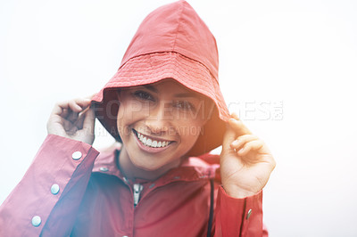 Buy stock photo Happy woman, portrait and red rain jacket with hat for weather, cloudy sky or winter season in outdoor storm. Face of female person with waterproof coat and smile for protection, fog or cold overcast