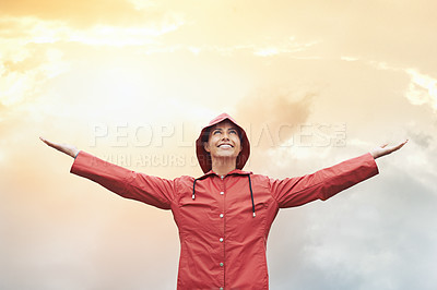Buy stock photo Happy woman, raincoat and freedom with weather for cloudy sky, sun or winter season in outdoor storm. Female person with smile in red waterproof rain jacket for overcast, fog or snow on mockup space
