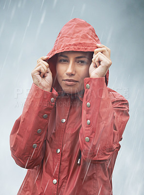 Buy stock photo Woman, rain and portrait with storm, raincoat and safety with protection in nature. Person, face and weather with cloudy, winter and waterproof hat for confidence with adventure or cold vacation
