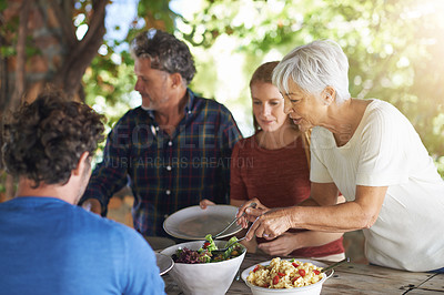Buy stock photo Food, party and salad with family at lunch and serving for health, bonding and celebration. Vacation, social and event with parents and children eating together for dining, generations and wellness