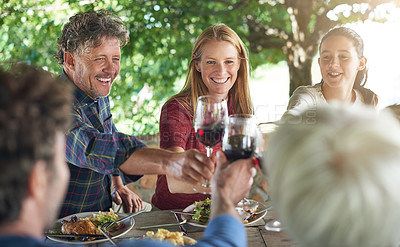 Buy stock photo Family, group and wine glass for toast at table for celebration, food and friends at lunch event. Men, women and smile together to celebrate with alcohol, glasses and support at party, dinner or home