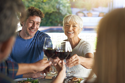 Buy stock photo Family, lunch and cheers with wine, celebration and bonding together with joy and weekend break. Group, generations and smile with food or alcohol with meal or relaxing with love and social gathering