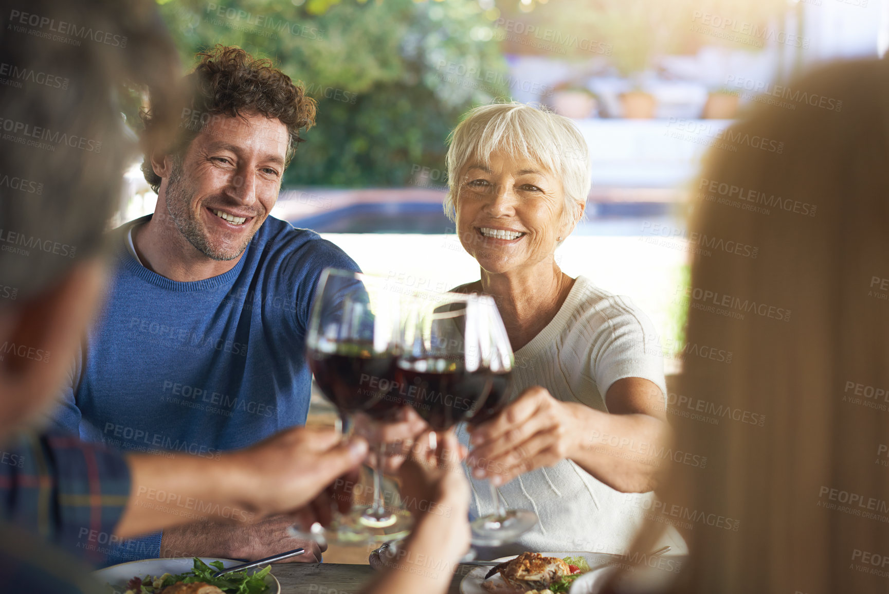 Buy stock photo Family, lunch and cheers with wine, celebration and bonding together with joy and weekend break. Group, generations and smile with food or alcohol with meal or relaxing with love and social gathering