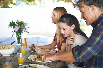 Buy stock photo Family, outdoor and lunch with celebration, relax and smile with social gathering, food and sunshine. Parents, group and mother with father or daughter with healthy meal and bonding together with joy