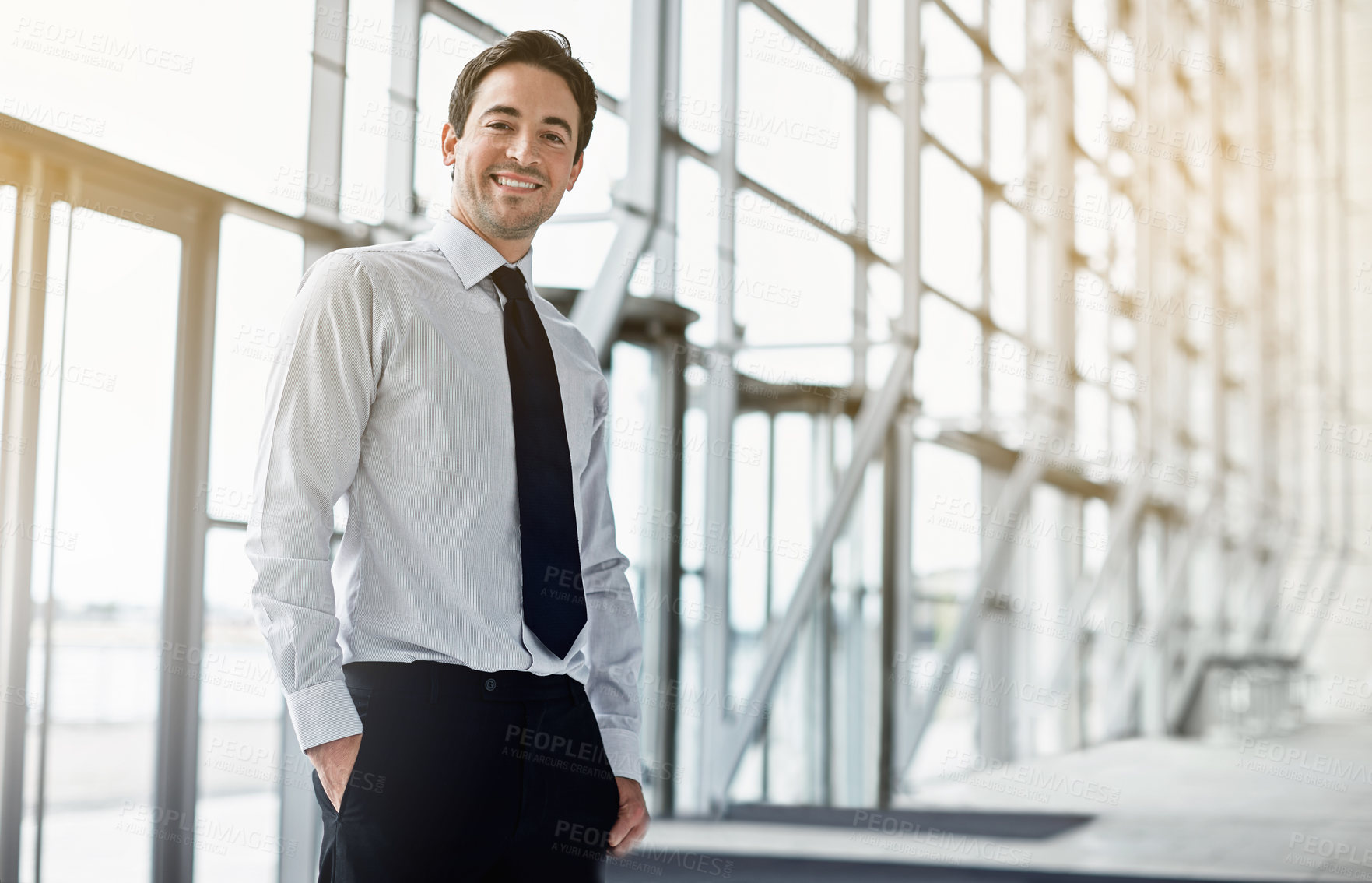 Buy stock photo Cropped portrait of a businessman standing in the lobby