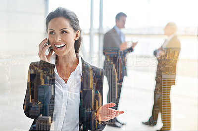 Buy stock photo Cropped shot of a businesswoman making a call with her colleagues in the background