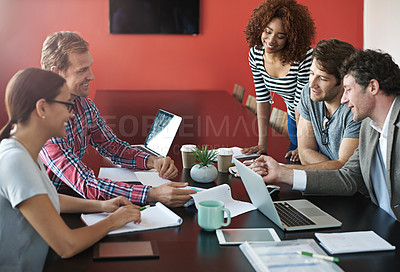 Buy stock photo Shot of a group of colleagues having a meeting in a boardroom