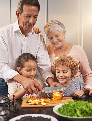 Buy stock photo Food, happy kids or grandparents teaching cooking skills for a healthy dinner with fruit or vegetables at home. Children learning, knife or grandmother with old man or diet meal nutrition in kitchen