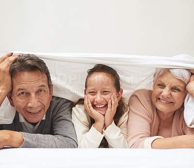 Buy stock photo Portrait, grandparents or happy girl in bedroom to relax together for bonding in Australia with love or care. Morning, faces or grandmother with funny child or old man to enjoy quality time on bed