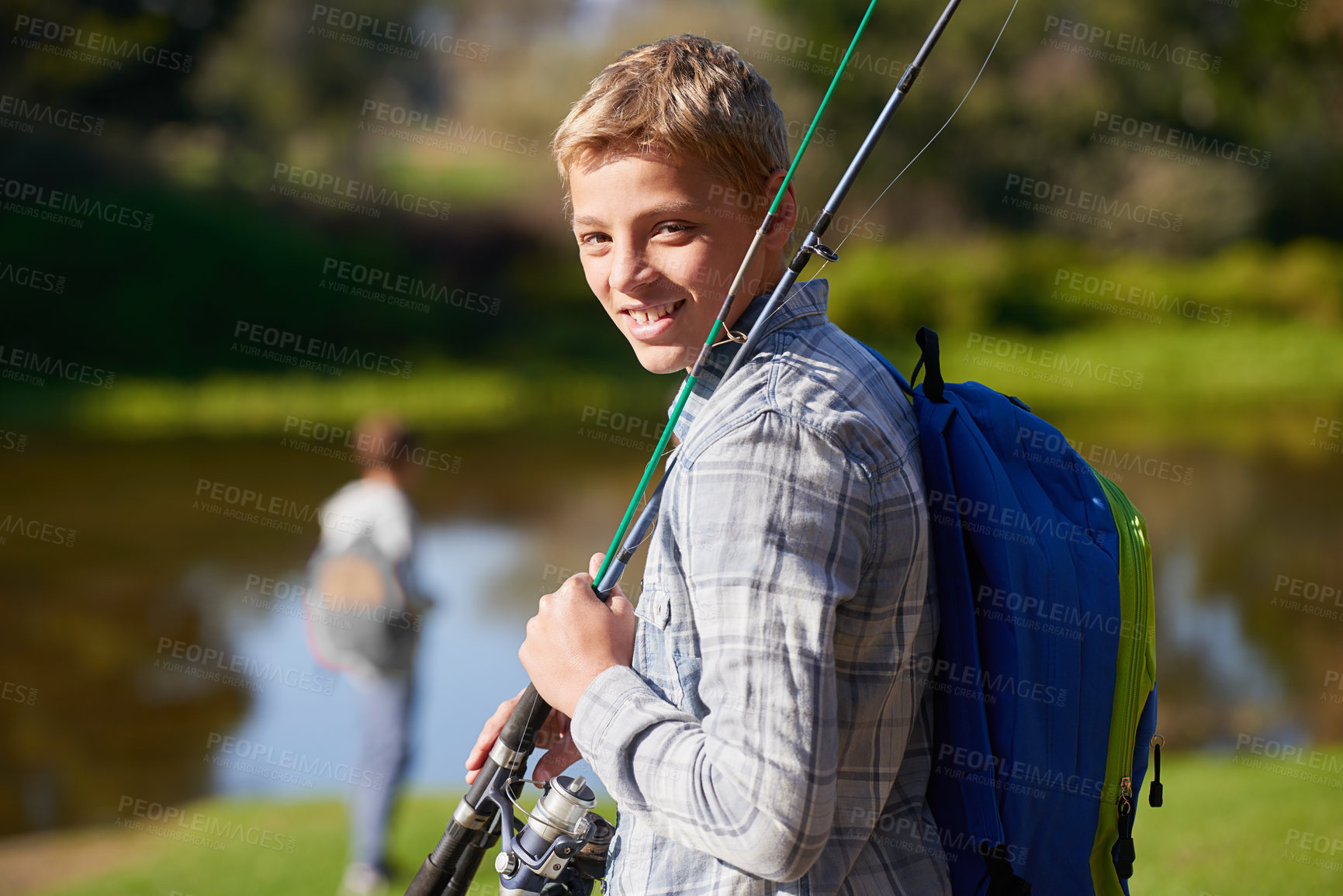 Buy stock photo Shot of a young boy on a fishing trip