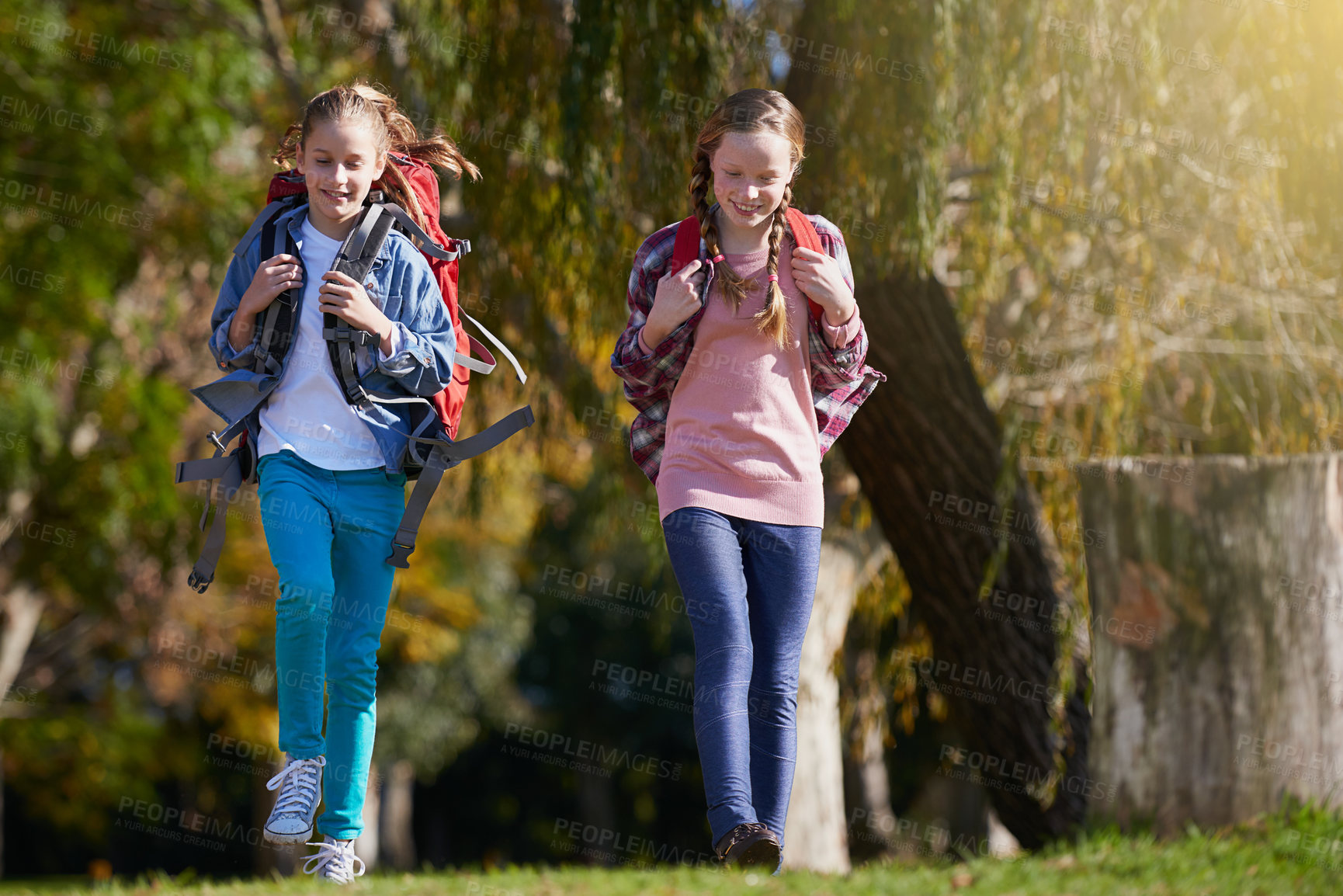 Buy stock photo Girls, nature and backpack for hike, walk and exercise for outdoor travel holiday. Fitness, fun and hobby for excited children friends, camping and vacation or weekend trip to countryside of England