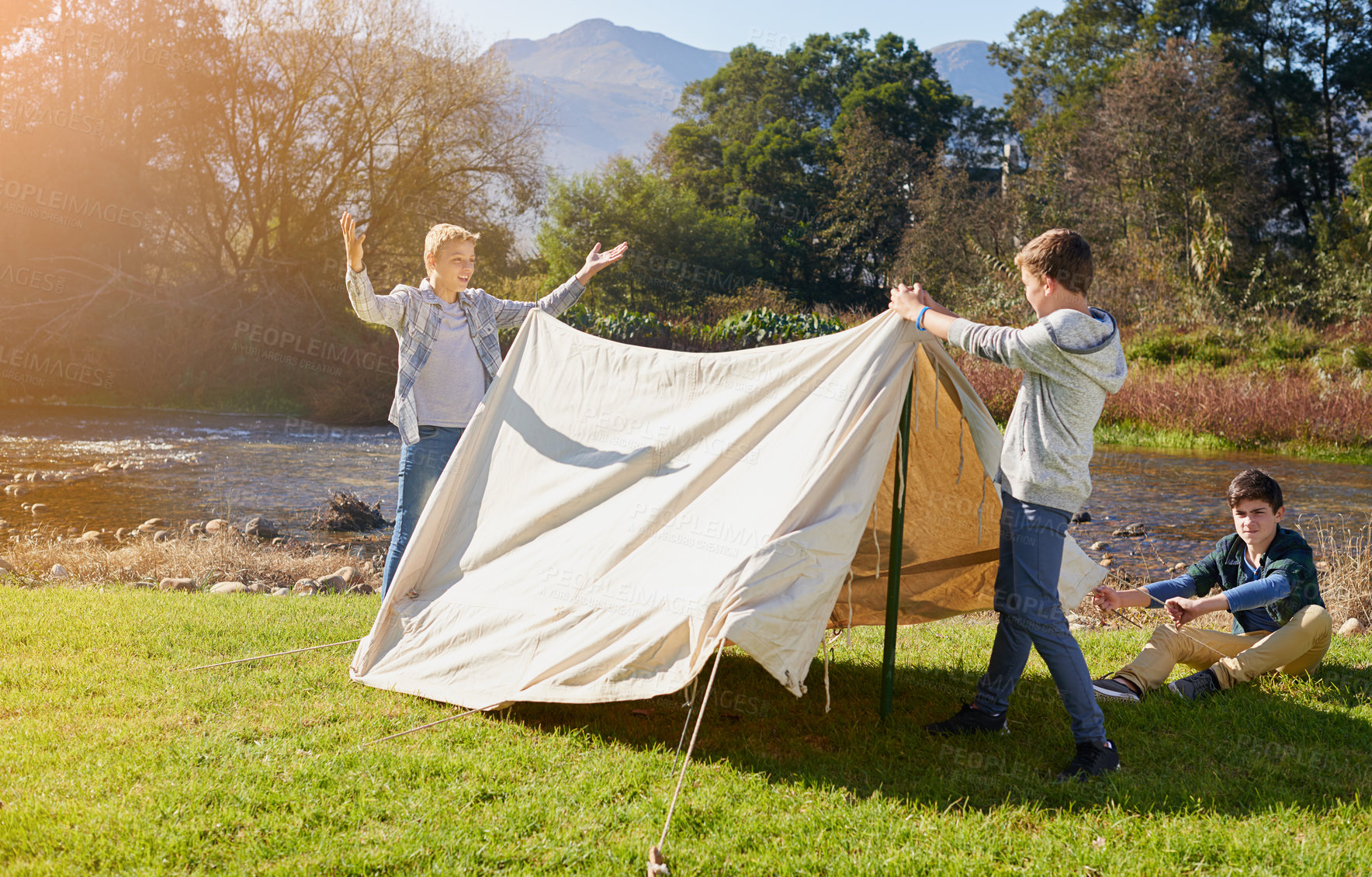 Buy stock photo Nature, boys and teamwork with tent for camping, adventure or holiday together in summer. Male people, friends and help with collaboration for vacation, shelter and childhood development in forest