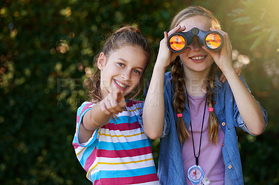 Buy stock photo Portrait, kids and friends with binoculars, pointing and searching with compass. Adventure, navigation and fun hobby for young girls in scouts, bird watching and travel on holiday in Kenya nature