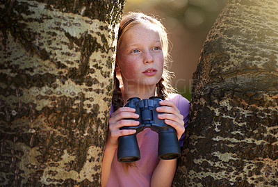 Buy stock photo Tree, girl and binoculars for safari, search and looking for animals on travel holiday. Curious, explore and seek for bird watching or wildlife in nature, young child and scenery or view in Kenya