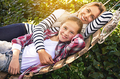 Buy stock photo Portrait, hammock and relax happy child, mother and family bonding, care and spending quality time together. Happiness, smile and Canada mom, kid or people enjoy Mothers Day in backyard nature garden