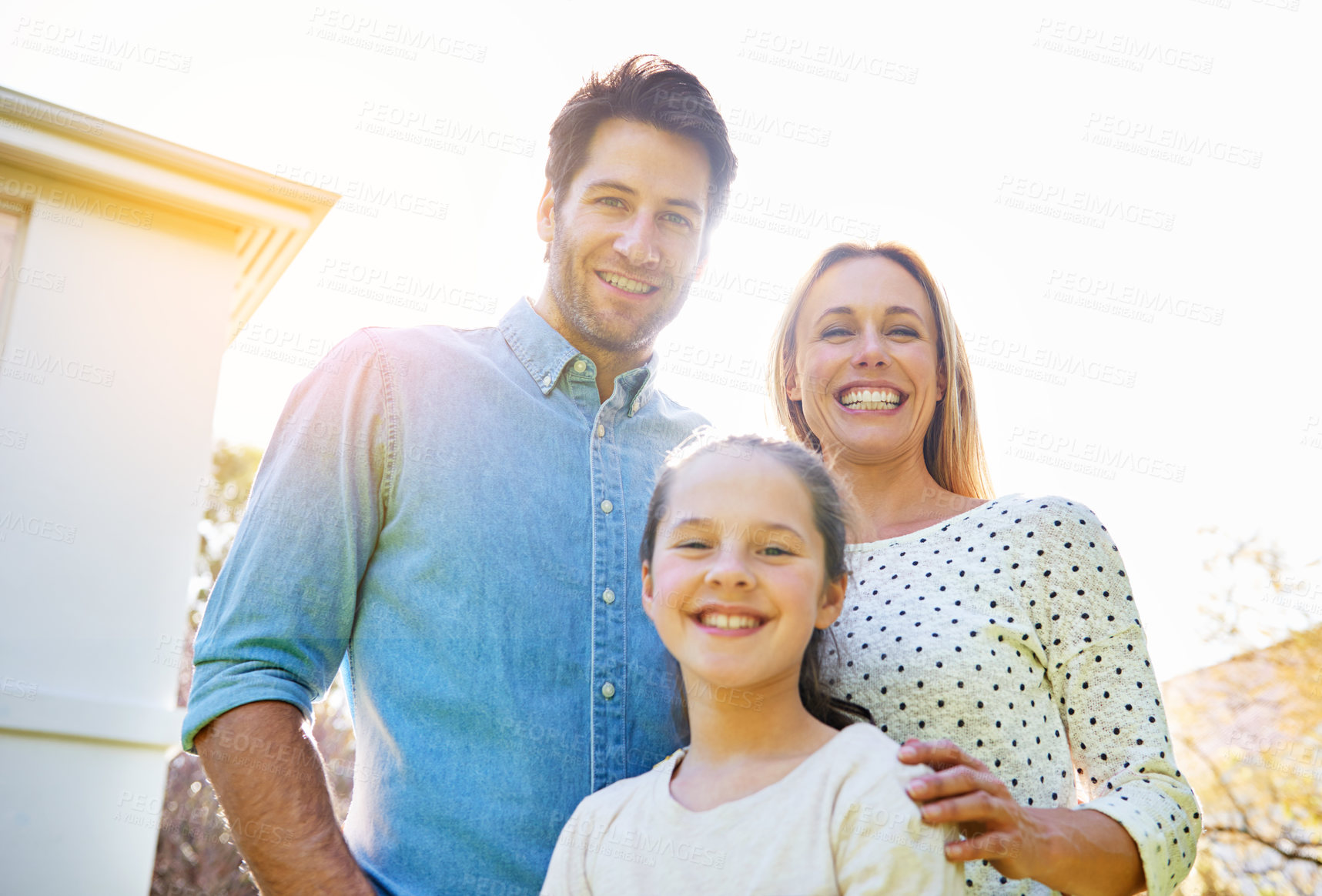 Buy stock photo Portrait, sunshine and happy family child, mother and father support, bonding and enjoy outdoor quality time together in Spain. Love, sky or happiness of mama, papa and youth kid smile for unity care