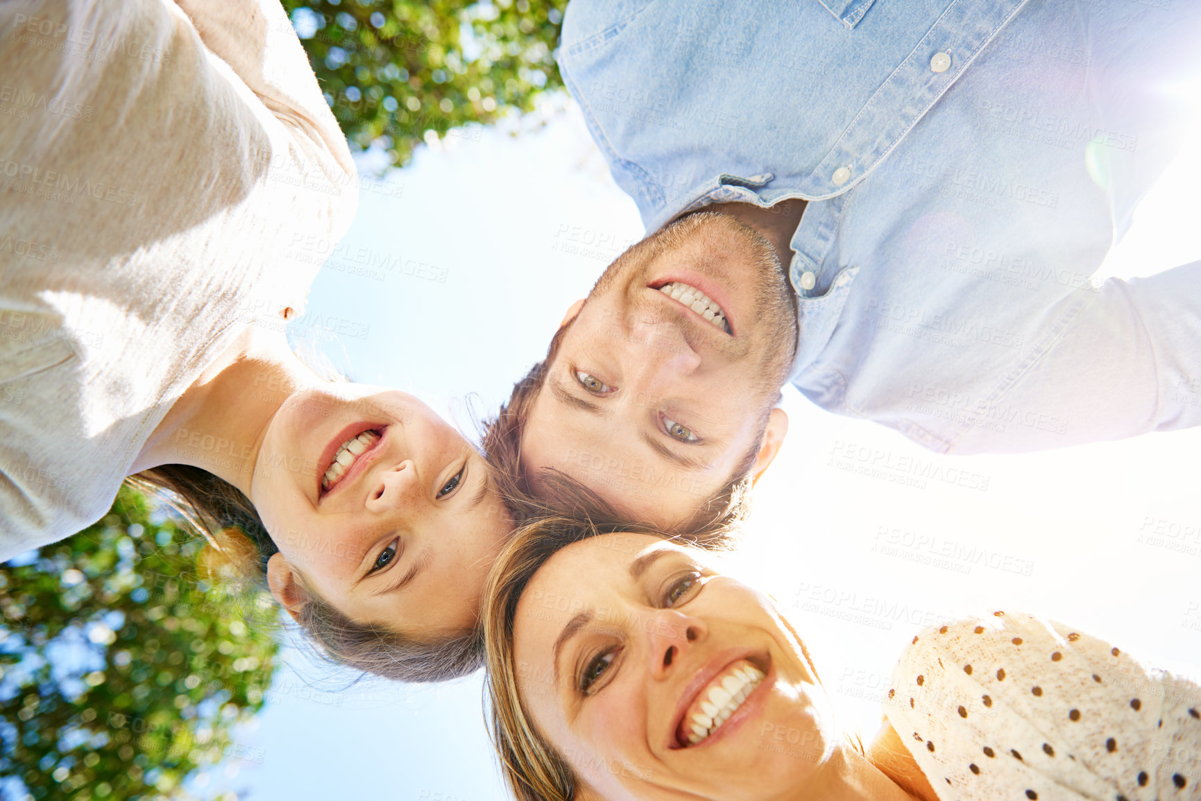 Buy stock photo Happy portrait, outdoor circle and family child, mother and father support, bonding and enjoy outdoor quality time together. Love, sky and below view of mama, papa and kid smile for nature sunshine