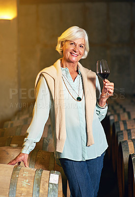 Buy stock photo Cropped portrait of a senior woman enjoying a little wine tasting