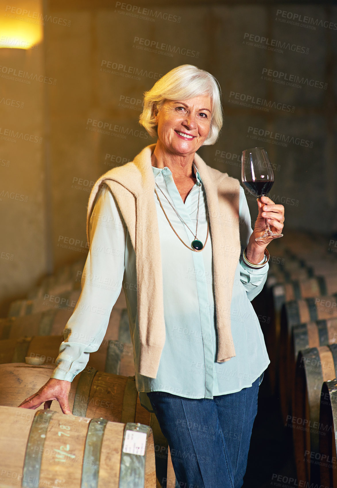 Buy stock photo Cropped portrait of a senior woman enjoying a little wine tasting