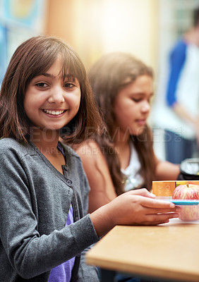 Buy stock photo Girl, happy and portrait with lunch at school for recess, break or nutrition at table with meal. Kid, face and smile at academy or relax with confidence, food or pride for childhood development