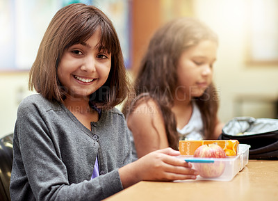 Buy stock photo Girl, smile and portrait with lunch at school for recess, break or nutrition at table with meal. Kid, face and happy at academy or relax with confidence, food and pride for childhood development