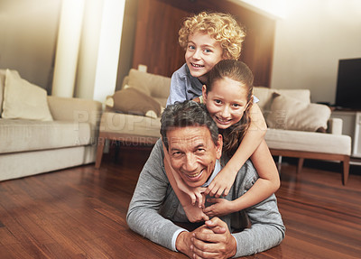 Buy stock photo Portrait, home and grandfather on the floor, grandchildren and happiness with stack and vacation. Face, apartment and elderly man with grandkids or bonding together with fun and playing with siblings