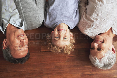 Buy stock photo Portrait, grandparents and boy on the wooden floor or bonding together with vacation or apartment. Family, face or elderly man with old woman, grandkid or child with fun or cheerful with home or love