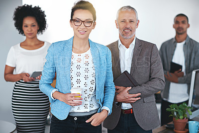 Buy stock photo Portrait of a group of positive coworkers standing in an office
