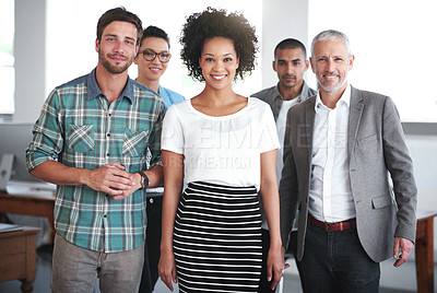 Buy stock photo Portrait of a group of positive coworkers standing in an office