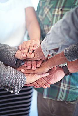 Buy stock photo Closeup shot of a group of coworkers with their hands in a huddle