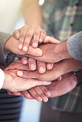 Buy stock photo Closeup shot of a group of coworkers with their hands in a huddle