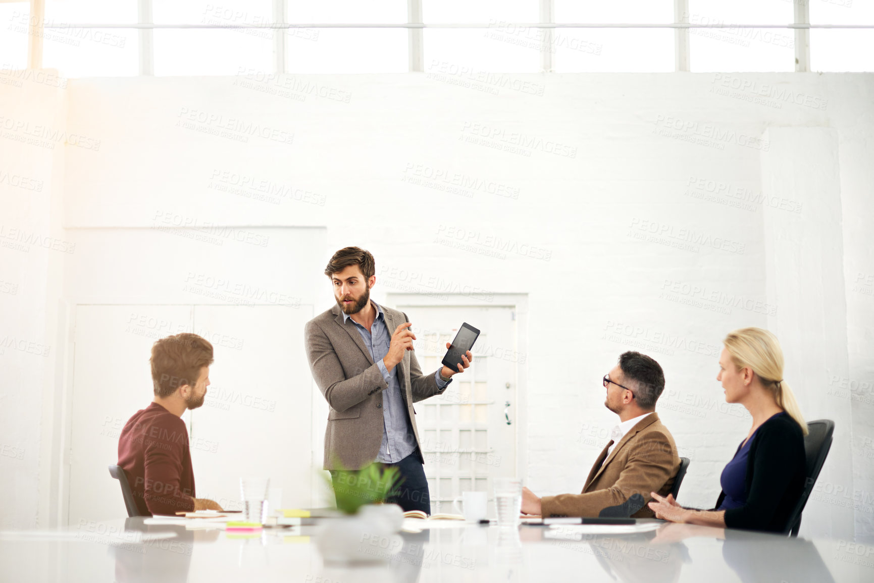 Buy stock photo Businessman, coach and talking with tablet for team meeting, presentation or collaboration at office. Man or speaker explaining to group of employees with technology for innovation at conference