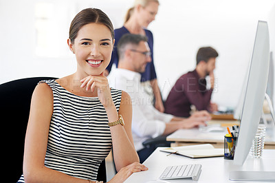 Buy stock photo Portrait of a female designer working at her office desk