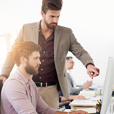 Buy stock photo Businessman, coaching and pointing with computer for advice, assistance or management at office desk. Young man helping employee or intern on technology for software, app or teamwork at workplace