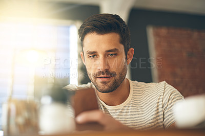 Buy stock photo Man, relax at cafe with smartphone and scroll online for social media, tech and communication. Chat, reading on mobile app or ebook with break at coffee shop, contact and using phone with network