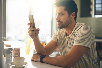 Buy stock photo Man, relax at coffee shop with smartphone and scroll online for social media, tech and communication. Chat, reading on mobile app or ebook with break at cafe, contact and using phone with network
