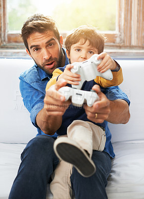 Buy stock photo Father, kid or remote to play, gaming or virtual to relax, esports or technology in living room. Dad, child or controller on sofa to teach, fun or challenge as video game, bonding or together
